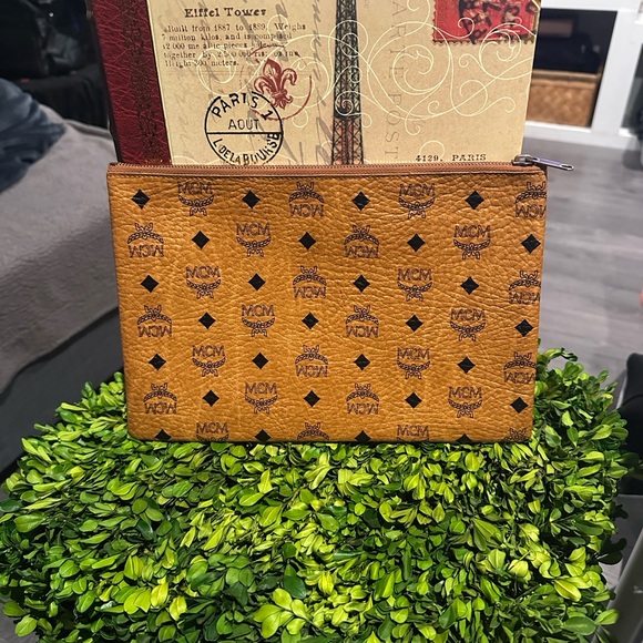 MCM Handbags - MCM Cognac Monogram clutch